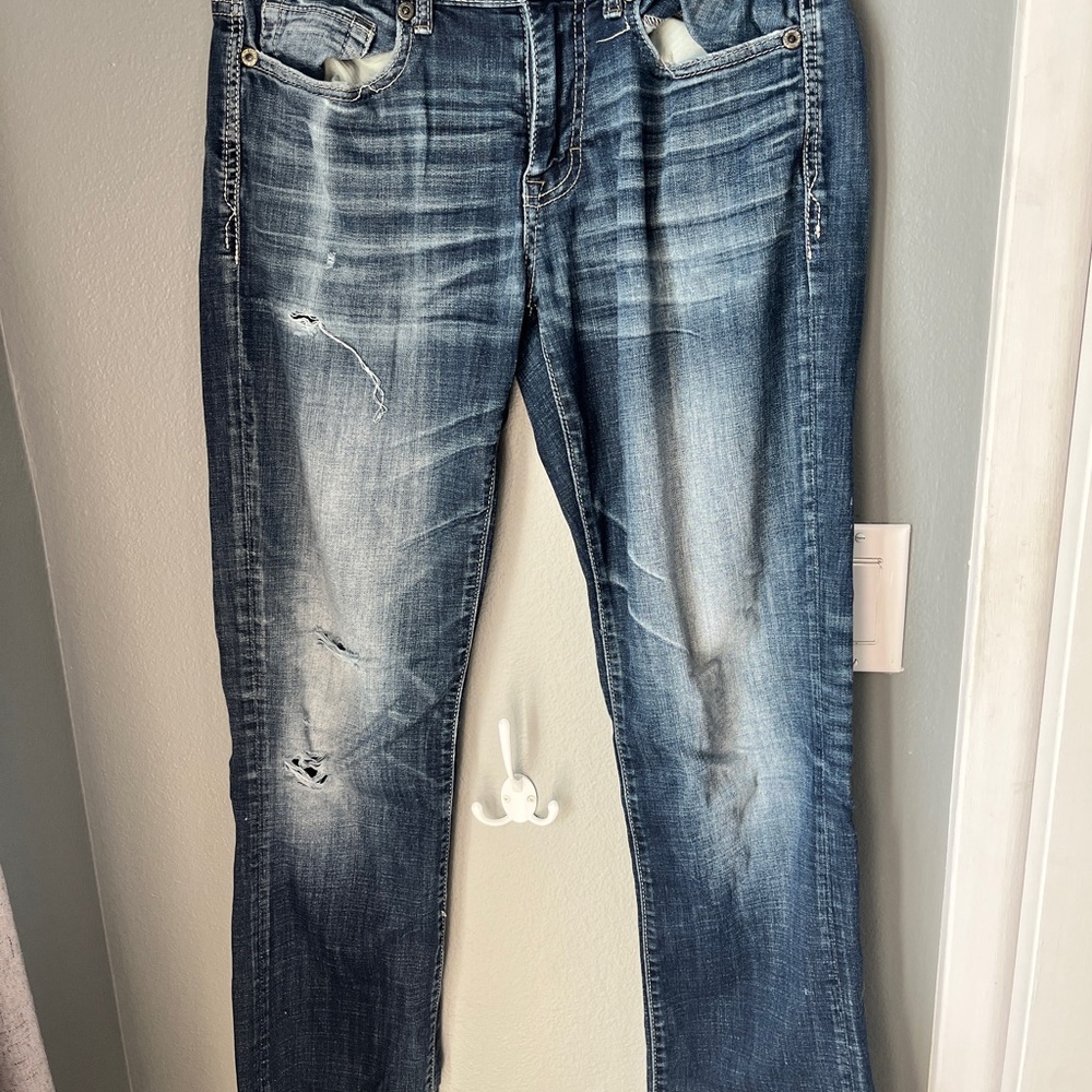 Distressed Blue Denim Jeans